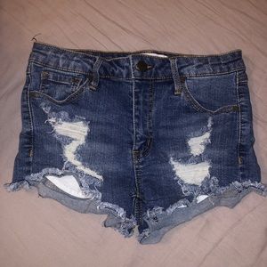 Distressed mid rise denim shorts